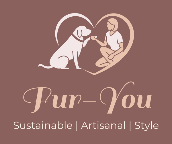 a dog facing their owner with their paw outstretched and the owner crouched holding the paw. together inside a heart