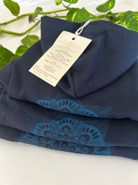 Stack of three folded mandala indigo dog hoodies