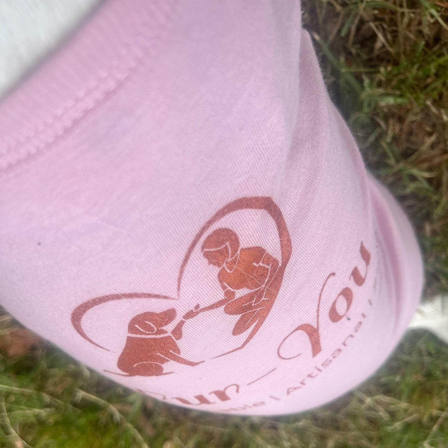 close up of print slightly angled in Copper print for Fur-You logo on Dusty Pink Tee