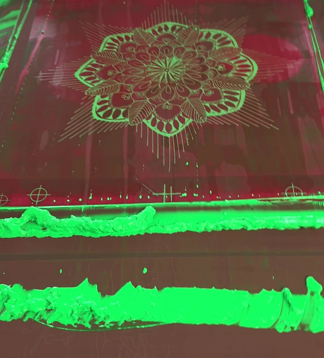 short video of screen after being printed in glow green the Mandala stencil that is then turned to show the hoodie panel piece it was printed onto